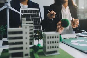 Carbon offset price report CO2 emission. Future growth Net zero waste in ESG ethical SME office protect climate change global warming social issues project. Group of asia people Eco friendly SDGs plan photo