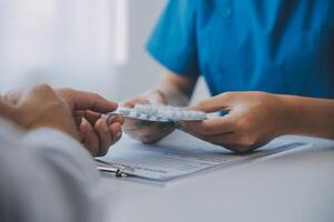 Doctor and patient are discussing consultation about symptom problem diagnosis of disease talk to the patient about medication and treatment method. photo