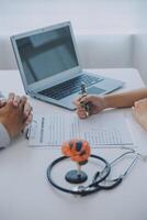 Doctor explaining brain functions to patient on model in office. photo