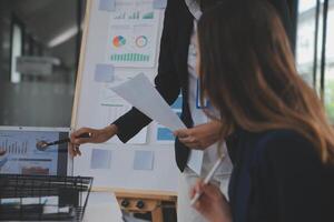 Close up ux developer and ui designer use augmented reality brainstorming about mobile app interface wireframe design on desk at modern office.Creative digital development agency photo