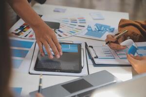 Close up ux developer and ui designer use augmented reality brainstorming about mobile app interface wireframe design on desk at modern office.Creative digital development agency photo