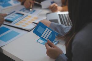 Close up ux developer and ui designer use augmented reality brainstorming about mobile app interface wireframe design on desk at modern office.Creative digital development agency photo