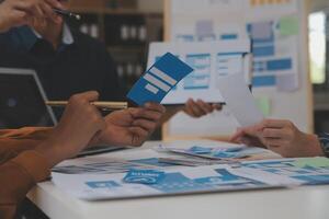 Close up ux developer and ui designer use augmented reality brainstorming about mobile app interface wireframe design on desk at modern office.Creative digital development agency photo