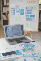 Close up ux developer and ui designer use augmented reality brainstorming about mobile app interface wireframe design on desk at modern office.Creative digital development agency photo