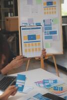 Close up ux developer and ui designer use augmented reality brainstorming about mobile app interface wireframe design on desk at modern office.Creative digital development agency photo