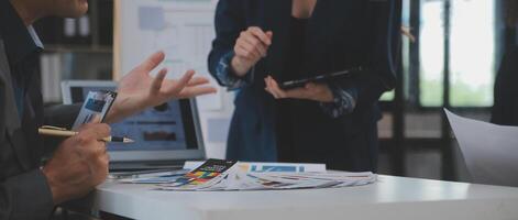 Close up ux developer and ui designer use augmented reality brainstorming about mobile app interface wireframe design on desk at modern office.Creative digital development agency photo