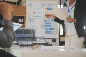 Close up ux developer and ui designer use augmented reality brainstorming about mobile app interface wireframe design on desk at modern office.Creative digital development agency photo