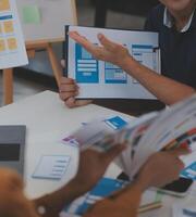 Close up ux developer and ui designer use augmented reality brainstorming about mobile app interface wireframe design on desk at modern office.Creative digital development agency photo