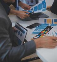 Close up ux developer and ui designer use augmented reality brainstorming about mobile app interface wireframe design on desk at modern office.Creative digital development agency photo