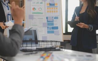 Close up ux developer and ui designer use augmented reality brainstorming about mobile app interface wireframe design on desk at modern office.Creative digital development agency photo