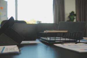 Laptop on a desk in an open financial office. photo