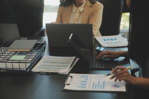 Business team collaboration discussing working analyzing with financial data and marketing growth report graph in team, presentation and brainstorming to strategy planning making profit of company. photo