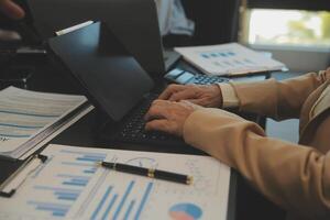Business team collaboration discussing working analyzing with financial data and marketing growth report graph in team, presentation and brainstorming to strategy planning making profit of company. photo