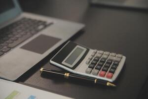 Laptop on a desk in an open financial office. photo