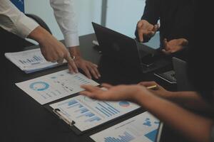 Business team collaboration discussing working analyzing with financial data and marketing growth report graph in team, presentation and brainstorming to strategy planning making profit of company. photo