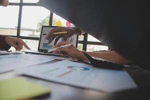 Finance manager meeting discussing company growth project success financial statistics, professional investor working start up project for strategy plan with document, laptop and digital tablet. photo