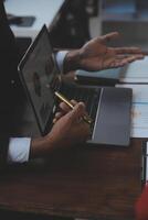 Finance manager meeting discussing company growth project success financial statistics, professional investor working start up project for strategy plan with document, laptop and digital tablet. photo
