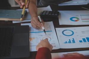 Finance manager meeting discussing company growth project success financial statistics, professional investor working start up project for strategy plan with document, laptop and digital tablet. photo