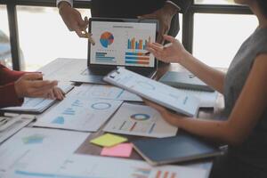 Finance manager meeting discussing company growth project success financial statistics, professional investor working start up project for strategy plan with document, laptop and digital tablet. photo