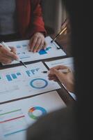 Finance manager meeting discussing company growth project success financial statistics, professional investor working start up project for strategy plan with document, laptop and digital tablet. photo