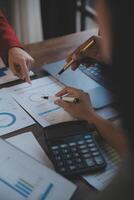 Finance manager meeting discussing company growth project success financial statistics, professional investor working start up project for strategy plan with document, laptop and digital tablet. photo
