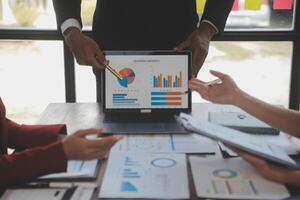 Finance manager meeting discussing company growth project success financial statistics, professional investor working start up project for strategy plan with document, laptop and digital tablet. photo