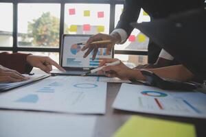 Finance manager meeting discussing company growth project success financial statistics, professional investor working start up project for strategy plan with document, laptop and digital tablet. photo