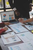 Finance manager meeting discussing company growth project success financial statistics, professional investor working start up project for strategy plan with document, laptop and digital tablet. photo