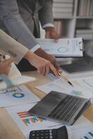 Finance manager meeting discussing company growth project success financial statistics, professional investor working start up project for strategy plan with document, laptop and digital tablet. photo