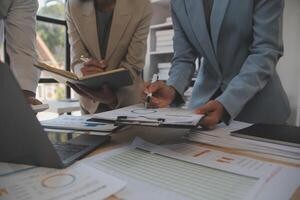 Finance manager meeting discussing company growth project success financial statistics, professional investor working start up project for strategy plan with document, laptop and digital tablet. photo