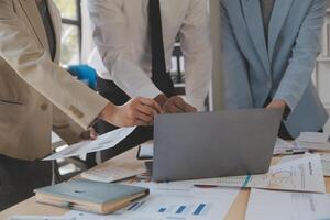 Finance manager meeting discussing company growth project success financial statistics, professional investor working start up project for strategy plan with document, laptop and digital tablet. photo