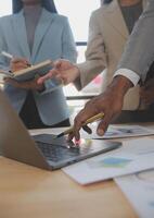 Finance manager meeting discussing company growth project success financial statistics, professional investor working start up project for strategy plan with document, laptop and digital tablet. photo