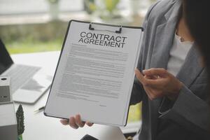 Business Signing a Contract Buy - sell house, insurance agent analyzing about home investment loan Real Estate concept. photo