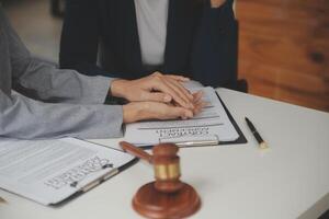 Lawyer, legal advisor, businessman brainstorming information on agreement details Business contracts in legal processing books for accuracy in contract documents. joint financial investment. photo