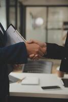 Business handshake for teamwork of business merger and acquisition,successful negotiate,hand shake,two businessman shake hand with partner to celebration partnership and business deal concept photo