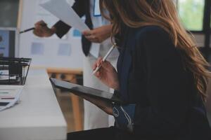 Close up ux developer and ui designer use augmented reality brainstorming about mobile app interface wireframe design on desk at modern office.Creative digital development agency photo