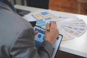 Close up ux developer and ui designer use augmented reality brainstorming about mobile app interface wireframe design on desk at modern office.Creative digital development agency photo