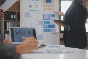 Close up ux developer and ui designer use augmented reality brainstorming about mobile app interface wireframe design on desk at modern office.Creative digital development agency photo