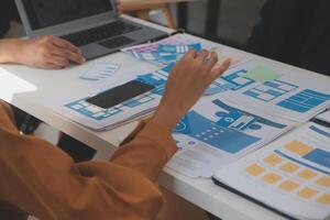 Close up ux developer and ui designer use augmented reality brainstorming about mobile app interface wireframe design on desk at modern office.Creative digital development agency photo