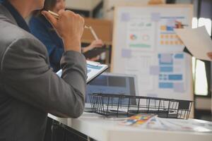 Close up ux developer and ui designer use augmented reality brainstorming about mobile app interface wireframe design on desk at modern office.Creative digital development agency photo