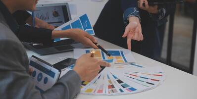 Close up ux developer and ui designer use augmented reality brainstorming about mobile app interface wireframe design on desk at modern office.Creative digital development agency photo