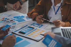 Close up ux developer and ui designer use augmented reality brainstorming about mobile app interface wireframe design on desk at modern office.Creative digital development agency photo