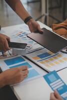 Close up ux developer and ui designer use augmented reality brainstorming about mobile app interface wireframe design on desk at modern office.Creative digital development agency photo