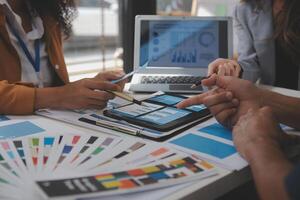 Close up ux developer and ui designer use augmented reality brainstorming about mobile app interface wireframe design on desk at modern office.Creative digital development agency photo