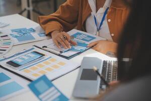 Close up ux developer and ui designer use augmented reality brainstorming about mobile app interface wireframe design on desk at modern office.Creative digital development agency photo