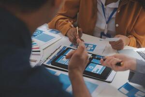 Close up ux developer and ui designer use augmented reality brainstorming about mobile app interface wireframe design on desk at modern office.Creative digital development agency photo