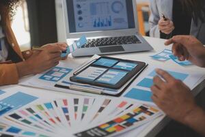 Close up ux developer and ui designer use augmented reality brainstorming about mobile app interface wireframe design on desk at modern office.Creative digital development agency photo