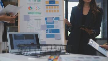 Close up ux developer and ui designer use augmented reality brainstorming about mobile app interface wireframe design on desk at modern office.Creative digital development agency photo