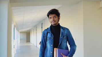 Indian student with a books in the university. New modern fully functional education facility. Education abroad video