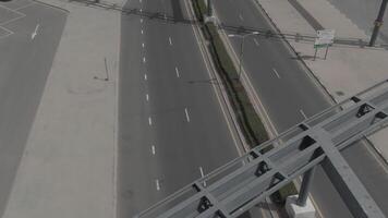 The drone shoots the movement of the car on a road video